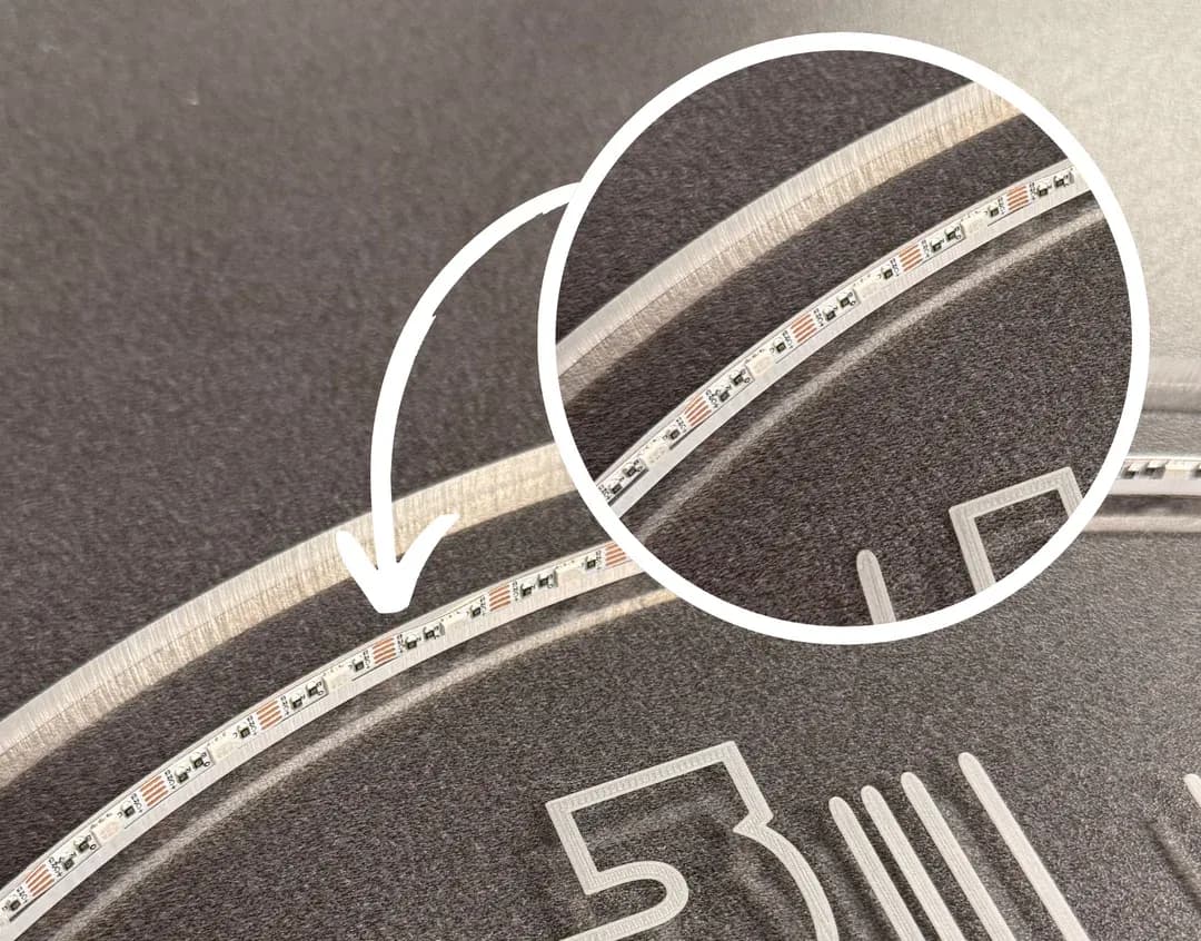 A macro close-up of a custom acrylic man cave sign showing the precision-embedded LED light strip integrated into the engraved border for a seamless glow.